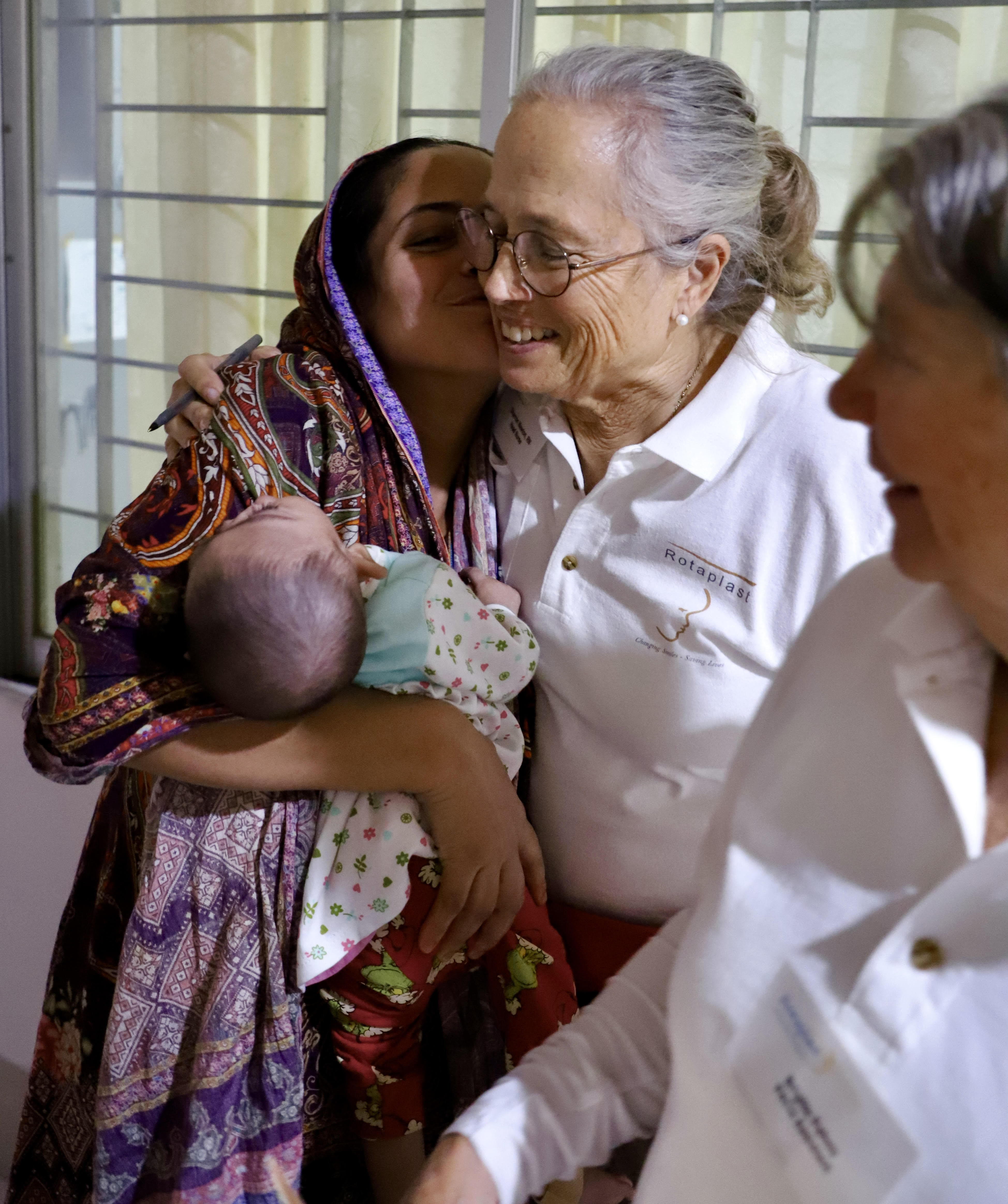 Rotaplast volunteer with family